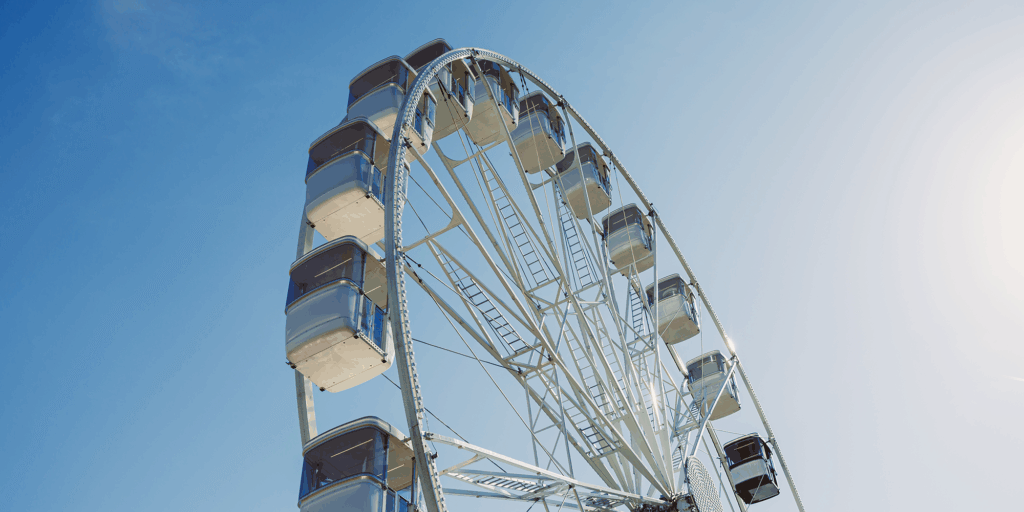 a-large-ferris-wheel-rises-into-the-air-with-cabin-2025-06-26-01-21-49-utc