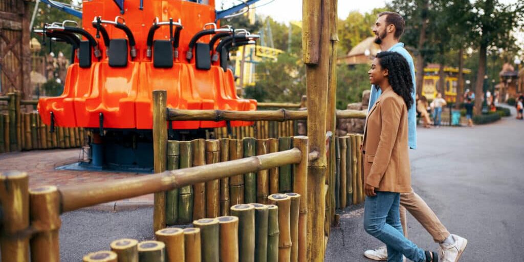 Love couple resting in amusement park